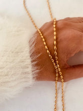 Load image into Gallery viewer, Close-up of 18K gold plated stainless steel Y-shaped necklace with delicate pearl fringe drop design
