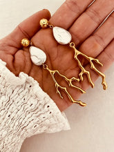 Učitaj sliku u preglednik galerije, Elevate your summer style with these stunning handmade statement earrings, featuring a bold combination of a lustrous natural freshwater pearl and a striking coral drop. Crafted from gold-plated stainless steel for durability and shine, these lightweight yet eye-catching earrings blend elegance with a touch of coastal charm—perfect for any occasion.