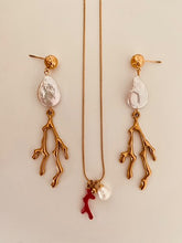 Učitaj sliku u preglednik galerije, Elevate your summer style with these stunning handmade statement earrings, featuring a bold combination of a lustrous natural freshwater pearl and a striking coral drop. Crafted from gold-plated stainless steel for durability and shine, these lightweight yet eye-catching earrings blend elegance with a touch of coastal charm—perfect for any occasion.