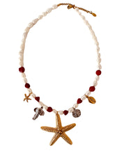 Load image into Gallery viewer, This handmade necklace features a beautiful blend of red and white freshwater and stone pearls, accented with summer-inspired charms. Adorned with a small starfish, a larger starfish, a shell, a silver elephant, and a silver starfish medallion, it captures the essence of coastal charm and sunny days. Perfect for adding a touch of beachy elegance to any outfit.