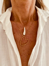 Load image into Gallery viewer, Add a touch of effortless charm with this delicate necklace, featuring a beautifully dainty chain and a unique heart contour pendant with an irregular shape and textured surface. Set at a stylish diagonal, the heart adds a playful twist to a timeless symbol—perfect for layering or wearing solo as a subtle statement of love and individuality.