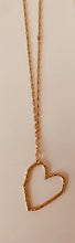 Load image into Gallery viewer, Add a touch of effortless charm with this delicate necklace, featuring a beautifully dainty chain and a unique heart contour pendant with an irregular shape and textured surface. Set at a stylish diagonal, the heart adds a playful twist to a timeless symbol—perfect for layering or wearing solo as a subtle statement of love and individuality.