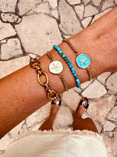 Load image into Gallery viewer, Close-up of the ADDISON bracelet with a gold starfish detail.