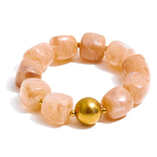 Load image into Gallery viewer, Close-up of green beige pink and amber acrylic beads showcasing vibrant tones and smooth finish