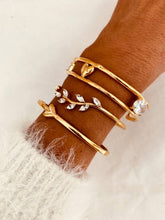 Load image into Gallery viewer, Minimalist gold bracelet featuring sparkling crystals.