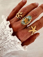 Load image into Gallery viewer, Close-up of gold and turquoise ring capturing shine and texture