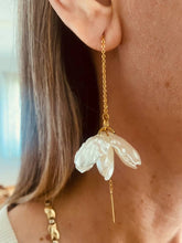 Load image into Gallery viewer, BIANKA pearl flower threader earrings worn on the ear featuring elegant pearl-effect petals suspended from delicate gold chains.