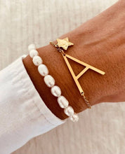 Load image into Gallery viewer, Gold plated stainless steel initial bracelet with star charm shown on wrist highlighting personalized jewelry design