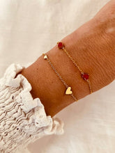 Load image into Gallery viewer, Three heart bracelet layered with other jewelry showing delicate stacking style