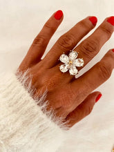 Load image into Gallery viewer, Close-up of the ABI flower ring highlighting brilliant crystal petals and real gold plated stainless steel craftsmanship.
