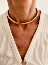 Load image into Gallery viewer, Gold plated snake chain necklace worn with casual outfit demonstrating versatility as everyday luxury jewelry piece