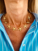 Load image into Gallery viewer, Gold plated stainless steel starfish necklace close up showing detailed ocean inspired jewelry design