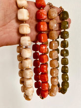 Učitaj sliku u preglednik galerije, Four IZZA marble necklaces displayed together, highlighting the different marbled colour variations and polished gold centre bead.