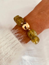 Load image into Gallery viewer, Olive Marble IZZA bracelet styled on the wrist with glossy green marbled resin beads and polished gold accents.