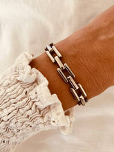 Load image into Gallery viewer, Close-up of geometric link bracelet showing polished metal structure and smooth finish