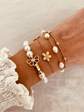 Load image into Gallery viewer, Pearl bracelet with gold buckle styled with outfit demonstrating clean modern everyday jewelry style