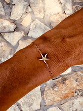 Load image into Gallery viewer, Gold bracelet with a delicate ocean-inspired starfish.