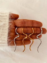 Load image into Gallery viewer, Close-up of HERMA sculptural earrings.