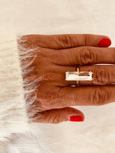 Load image into Gallery viewer, Close-up of the PAISA crystal ring highlighting the brilliant rectangular crystal and real gold plated stainless steel design.
