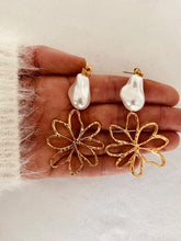 Učitaj sliku u preglednik galerije, Floral pearl statement earrings displayed on neutral background showcasing modern elegant jewelry design