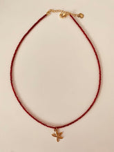 Load image into Gallery viewer, ASTRA red rhinestone beaded necklace with a gold starfish pendant.