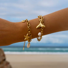 Load image into Gallery viewer, Add a touch of seaside charm to your look with this summer stainless steel bracelet. Plated in radiant 18K gold and designed with a delicate drop chain, this stylish bracelet features playful shells and starfish charms that capture the essence of summer. Waterproof and durable, it's perfect for everyday wear, whether you're at the beach or adding a touch of whimsy to your daily outfit.