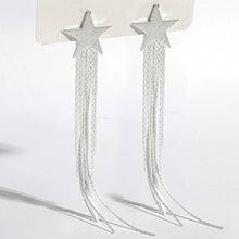 Učitaj sliku u preglednik galerije, Close-up of silver star earrings with polished finish and sleek tassel chains emphasizing contemporary style