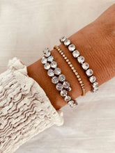 Load image into Gallery viewer, Detailed view of tennis bracelet capturing crystal shine and light reflection
