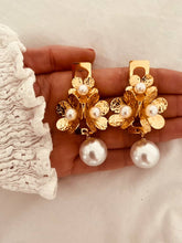 Load image into Gallery viewer, Vintage floral pearl statement earrings in stainless steel shown from front angle highlighting elegant retro jewelry design