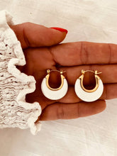 Load image into Gallery viewer, White acrylic hoop earrings with gold inner line and stainless steel base shown from front angle highlighting modern minimalist jewelry design