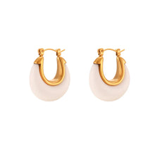 Load image into Gallery viewer, Close-up of white acrylic hoop earrings showcasing delicate gold inner detail and smooth finish
