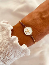 Load image into Gallery viewer, White enamel bracelet with a delicate gold starfish.