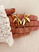Load image into Gallery viewer, Zircon flower star tassel earrings in stainless steel shown from front angle highlighting elegant sparkling statement jewelry design