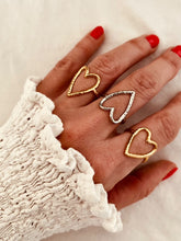 Load image into Gallery viewer, Adjustable hollow heart gold ring on woman’s hand
