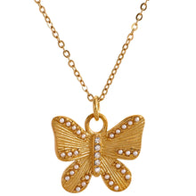 Load image into Gallery viewer, Close up of carved butterfly pendant with pearls and cubic zirconia details