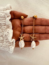 Load image into Gallery viewer, Elegant gold drop earrings with pearl-inspired detail and starfish charm