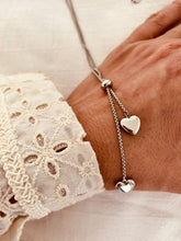 Load image into Gallery viewer, Double heart pendant necklace with adjustable layered chains in stainless steel showing modern elegant design in gold or silver tone