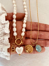 Load image into Gallery viewer, Gold necklace with turquoise charm pendant and symbolic details