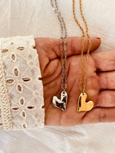 Load image into Gallery viewer, Gold and silver heart pendant necklaces displayed together to show color options and styling versatility