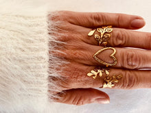 Load image into Gallery viewer, Gold botanical statement ring styled with floral rings, elegant adjustable women’s jewelry