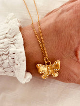 Load image into Gallery viewer, Gold butterfly necklace with pearl and cubic zirconia accents front view