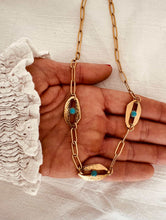 Load image into Gallery viewer, Gold evil eye necklace with chunky chain and three blue stone eye charms front view