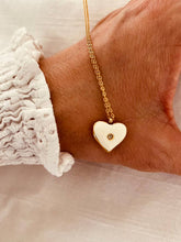 Load image into Gallery viewer, Gold heart necklace with white enamel pendant front view