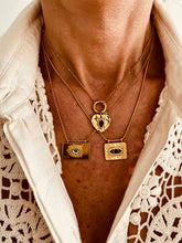 Load image into Gallery viewer, Gold heart pendant necklace worn on model with vintage inspired design