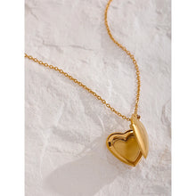 Load image into Gallery viewer, Elegant 18K gold plated stainless steel heart locket necklace styled as romantic jewelry gift.