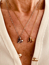 Load image into Gallery viewer, Stainless steel heart pendant necklace worn on model styled with simple outfit for clean modern everyday fashion inspiration