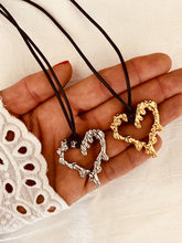 Load image into Gallery viewer, hollow lava heart pendant necklace close up gold and silver stainless steel detail