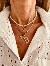 Load image into Gallery viewer, Woman wearing personalized pearl necklace with gold initial