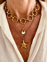 Load image into Gallery viewer, Starfish necklace styled in a layered beach-inspired jewelry look