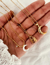 Load image into Gallery viewer, Elegant moon pendant necklace styled for sophisticated and evening looks